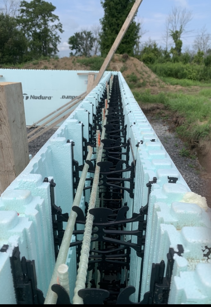 Insulated concrete forms and reinforcement